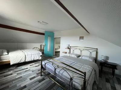 Un ou plusieurs lits dans un hébergement de l'établissement Couleurs de la vie - Chambres d'Hôtes et Gîte