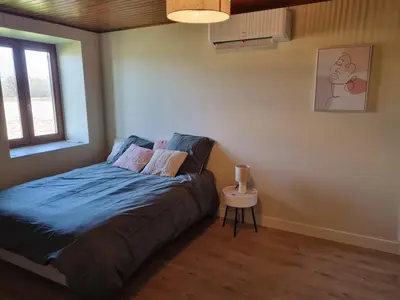Un ou plusieurs lits dans un hébergement de l'établissement Au Marlézay country house 4 personnes