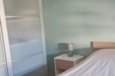 Un ou plusieurs lits dans un hébergement de l'établissement Charmant duplex avec grand balcon