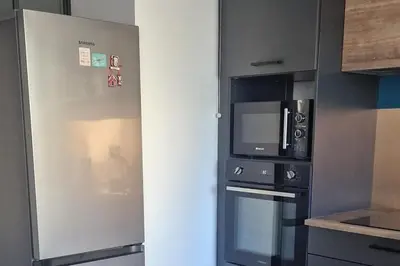 Cuisine ou kitchenette dans l'établissement Charmant duplex avec grand balcon