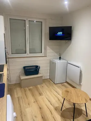 Télévision ou salle de divertissement dans l'établissement Le lodge