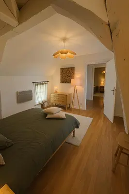 Un ou plusieurs lits dans un hébergement de l'établissement La maison du canal