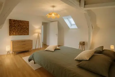Un ou plusieurs lits dans un hébergement de l'établissement La maison du canal
