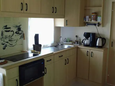 Cuisine ou kitchenette dans l'établissement Le Cèdre