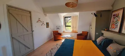 Coin salon dans l'établissement La Popinette Chambre d'hôte