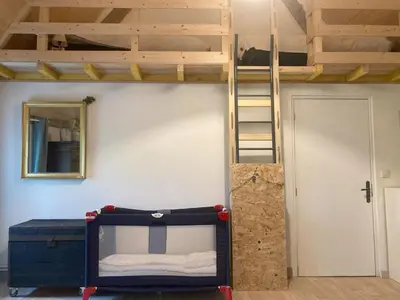 Un ou plusieurs lits dans un hébergement de l'établissement Gîte Le Nid Abord