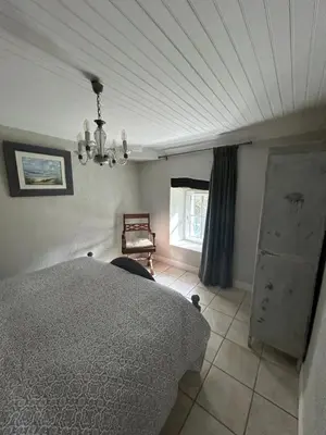 Un ou plusieurs lits dans un hébergement de l'établissement Le Petit Moulin
