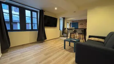 Coin salon dans l'établissement Le Cocon Tournusien