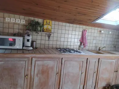 Cuisine ou kitchenette dans l'établissement Le Loft