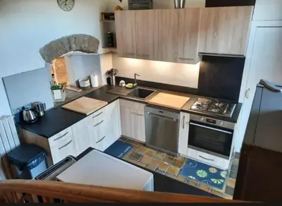 Cuisine ou kitchenette dans l'établissement La Maison Bleue Ancienne Ecole