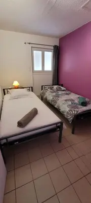Un ou plusieurs lits dans un hébergement de l'établissement La maison des vendangeurs