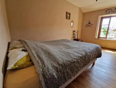 Un ou plusieurs lits dans un hébergement de l'établissement MAISON EN PIERRE type CHATEAU