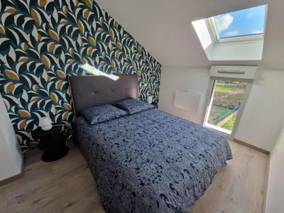 Un ou plusieurs lits dans un hébergement de l'établissement Charmante maison de village