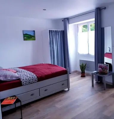 Un ou plusieurs lits dans un hébergement de l'établissement Studio paisible en Morvan