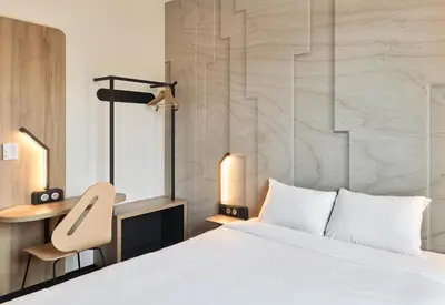 Un ou plusieurs lits dans un hébergement de l'établissement B&B HOTEL Mâcon Sud 3 étoiles