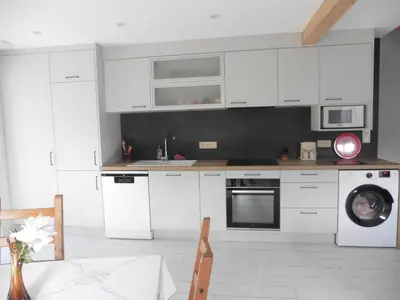 Cuisine ou kitchenette dans l'établissement Appartement cosy au calme