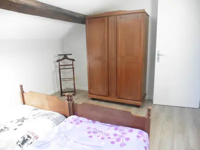 Un ou plusieurs lits dans un hébergement de l'établissement Appartement cosy au calme