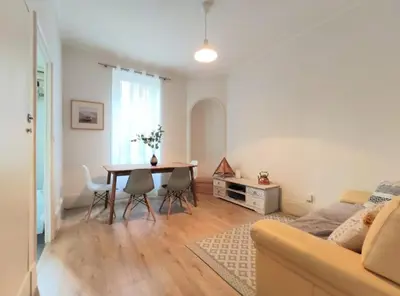 Coin salon dans l'établissement Logement COSY proche centre-ville - WiFi
