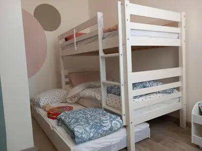 Un ou plusieurs lits dans un hébergement de l'établissement Dijon en famille - cosy, équipé bébé - 5 mn centre ville