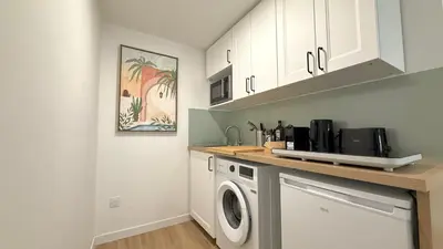 Cuisine ou kitchenette dans l'établissement Le Confortable Centre Ville