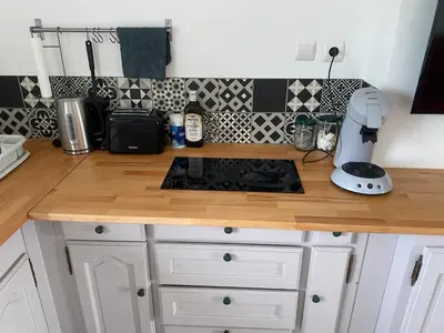 Cuisine ou kitchenette dans l'établissement Joli t2 au calme