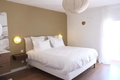 Un ou plusieurs lits dans un hébergement de l'établissement La Petite Maison