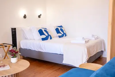 Un ou plusieurs lits dans un hébergement de l'établissement Le Ptit St Pierre - Studio en Hyper Centre