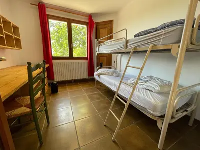Un ou plusieurs lits dans un hébergement de l'établissement Maison familiale- 12 couchages - 6 chambres, piscine, très grand jardin