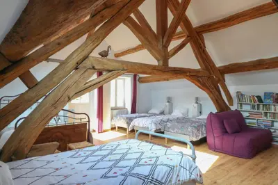 Un ou plusieurs lits dans un hébergement de l'établissement Gîte des Pommiers