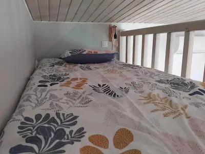 Un ou plusieurs lits dans un hébergement de l'établissement Maison pétanque piscine 2 à 6 personnes
