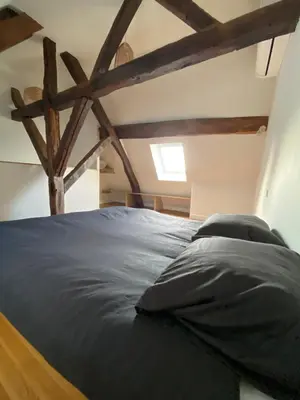 Un ou plusieurs lits dans un hébergement de l'établissement Appartement coeur de Beaune