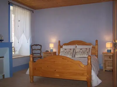 Un ou plusieurs lits dans un hébergement de l'établissement Gîte au calme