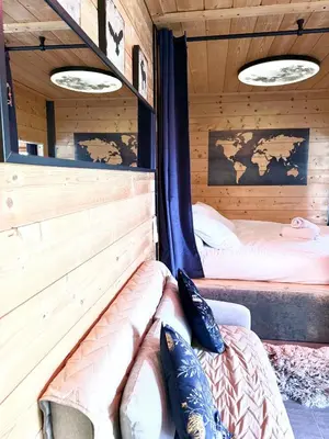 Un ou plusieurs lits dans un hébergement de l'établissement La Cabane SPA