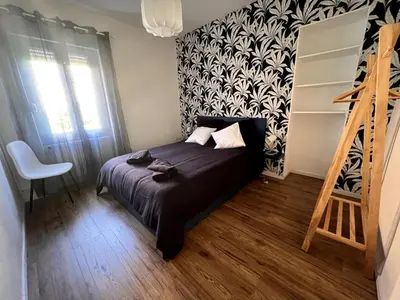 Un ou plusieurs lits dans un hébergement de l'établissement Appartement Coeur du Creusot