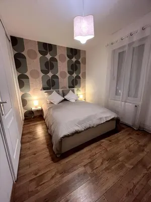 Un ou plusieurs lits dans un hébergement de l'établissement Appartement Coeur du Creusot