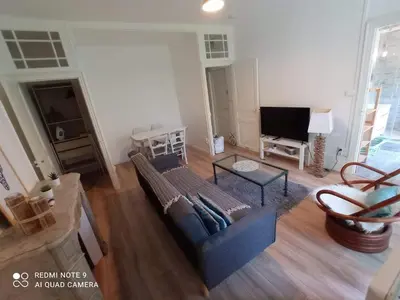 Télévision ou salle de divertissement dans l'établissement Appartement familial Fleur de coton - centre-ville