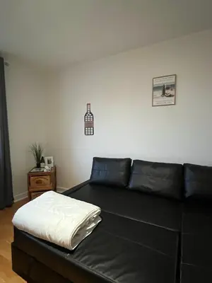Coin salon dans l'établissement Studio Manuia Climatisé au centre ville
