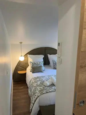 Un ou plusieurs lits dans un hébergement de l'établissement Jolie Maison avec Balnéothérapie