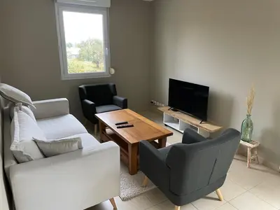 Télévision ou salle de divertissement dans l'établissement Appartement 3 chambres et 2 Parkings
