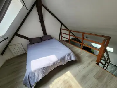 Un ou plusieurs lits dans un hébergement de l'établissement L'appartement d'Edmond Bour