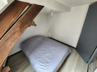 Un ou plusieurs lits dans un hébergement de l'établissement L'appartement d'Edmond Bour