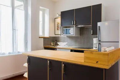 Cuisine ou kitchenette dans l'établissement Le Pasteur