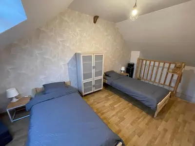 Un ou plusieurs lits dans un hébergement de l'établissement Petite maison avec cour