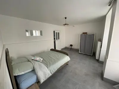 Un ou plusieurs lits dans un hébergement de l'établissement Petite maison avec cour
