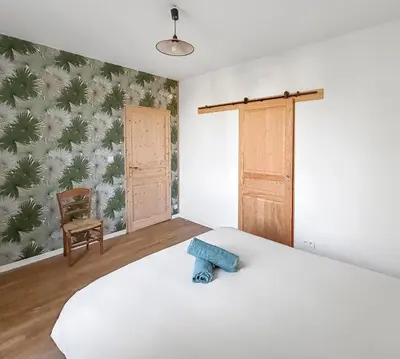 Un ou plusieurs lits dans un hébergement de l'établissement Maison cosy avec jardin, 4 chambres, Route du Vin