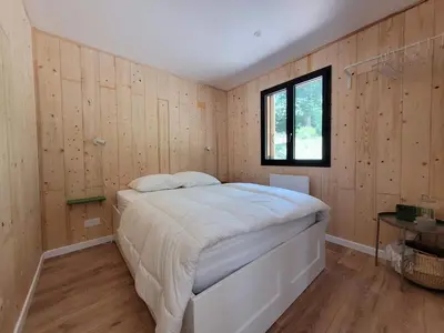 Un ou plusieurs lits dans un hébergement de l'établissement Maison bord du Lac des Settons