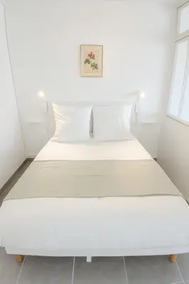 Un ou plusieurs lits dans un hébergement de l'établissement L'Albatros - Appartement de charme à Digoin