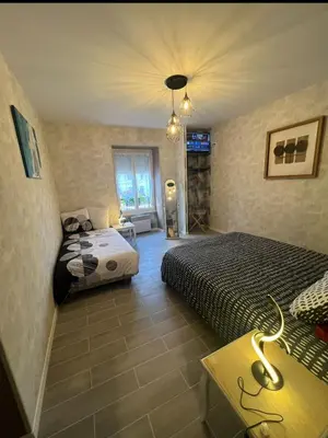 Un ou plusieurs lits dans un hébergement de l'établissement Gite la Vieille Auberge de Chaumard