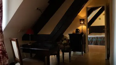 Un ou plusieurs lits dans un hébergement de l'établissement Logis Hôtel L'Orée des Charmes et son restaurant L'évYdenCe