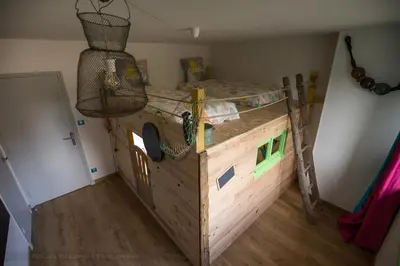 Un ou plusieurs lits dans un hébergement de l'établissement Gîte Aux Couleurs de Saint Martin avec SPA-Billard